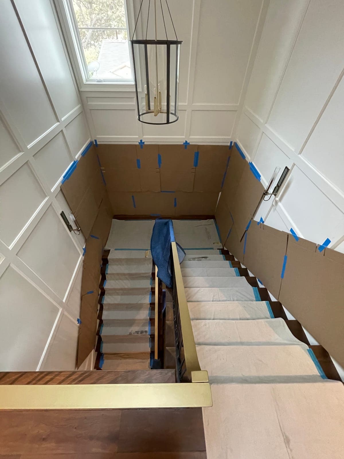 Floors, stair banister and walls padded and protected during a home move